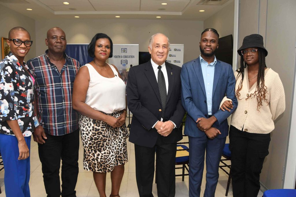 Najae Murray, (second right) shares the spotlight with from left: Tameka Wilson, friend; Radcliffe Blackwood, stepfather; Georgia Blackwood, mother; Parris Lyew-Ayee, chairman of the JN Foundation; and Arianna Blackwood, sister. The occasion was a courtesy call on the chief executive officer of The Jamaica National Group, Hon Earl Jarrett, at the Group’s corporate office on August 22.  