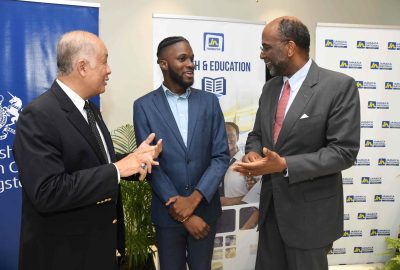 Earl Jarrett (right) chief executive officer (CEO), The Jamaica National Group, and Parris Lyew-Ayee (left), chairman of the JN Foundation, congratulate Najae Murray, the inaugural recipient of the historic Chevening/JN Oliver F Clarke scholarship, during a courtesy call on the CEO at the Group’s corporate office on August 22.