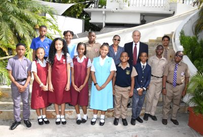 Claudine Allen, third right at the back, general manager of the JN Foundation, and Parris Lyew-Ayee, (second right, backrow), chairman of the JN Foundation take a group photo with last year’s scholarship recipients of JN Group members of staff.